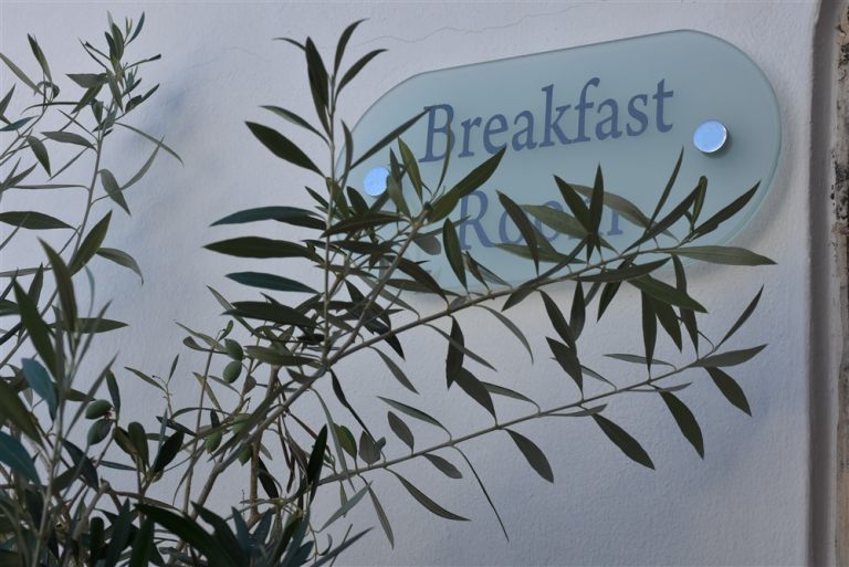 The olive oil outside of the luxury Nostos Apartments in Oia Santorini