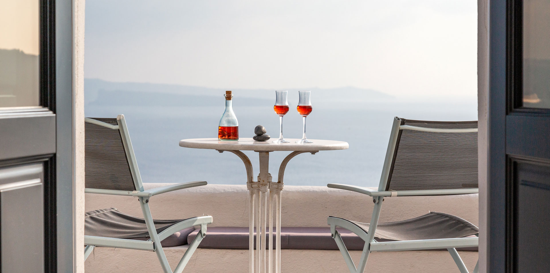 The magnificent private veranda of the luxury Junior Suite of Nostos Apartments in Oia Santorini