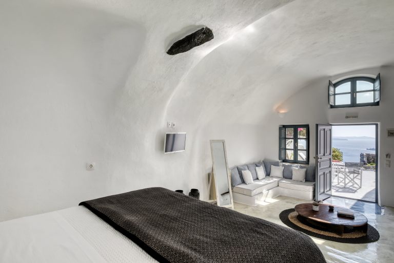 The amazing bedroom of the luxury apartments of Nostos Apartments in Oia Santorini